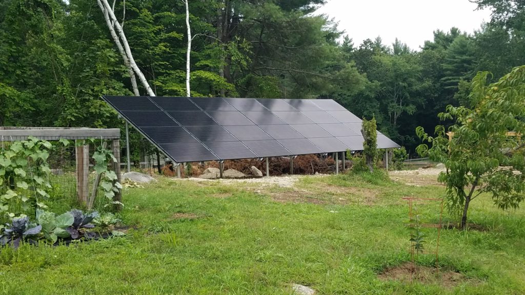 This 8.12 kW ground-mounted system was built in Townsend, MA with Hanwha 290-watt panels and SolarEdge inverter.