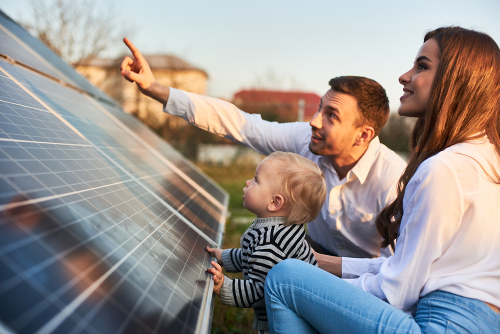 A family reviewing their new solar panels together