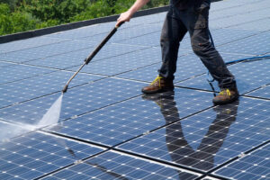 Man Cleaning Solar Panels